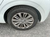 a close up of a car ' s tire on the pavement