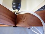 a close up of a book with a cord attached to it
