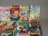 a lot of comic books sitting on a table