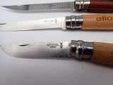 three different types of knives on a white surface