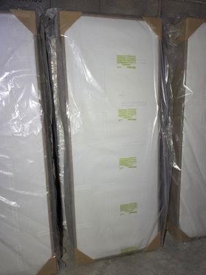 several boxes of mattresses are wrapped in plastic and ready to be shipped