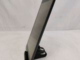 a black tablet computer sitting on top of a white table