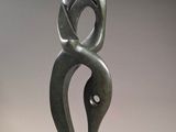 sculpture of a woman holding a child in her arms
