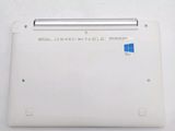the back of a white laptop with a blue sticker on it