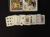 a lot of playing cards that are on the table