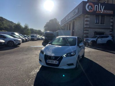 a white car that is parked in a parking lot