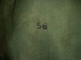 a close up of a green jacket with the number 55 on it