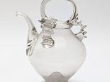 silver plated glass teapot with flower decoration on stand