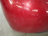 a close up of a red car that is painted red