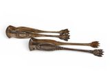 two wooden spoons with metal handles on a white background