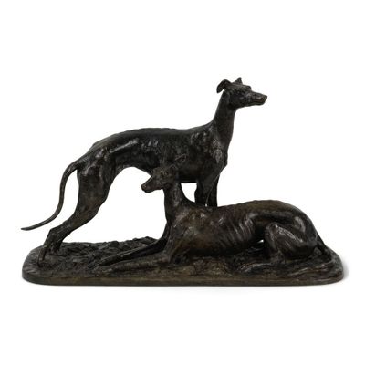 une image représentant une statue d'un chien et d'un chat sur un rocher
