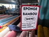 a sign that is in front of some fabrics