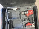 an open tool box with a hammer and a wrenet inside of it