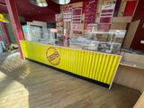 a yellow and red counter in a fast food restaurant