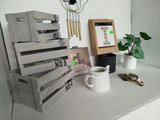 a stack of wooden crates sitting on a counter