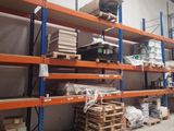 a large warehouse with lots of shelves and pallets in it