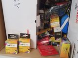 a white refrigerator sitting inside of a box filled with assorted items