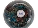 a close up of a glass ball with a sticker on it