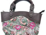 pink and green paisley print purse with brown leather handles