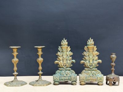 four candles that are sitting next to each other on a table