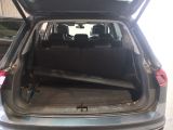a car with its trunk open in a garage