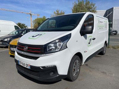 a white van that is parked in a parking lot