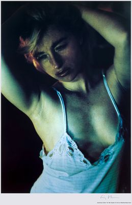 a woman in a white top posing for a picture