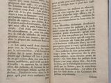 a book open to a page of text on a table