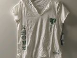 white v - neck t - shirt with green leaves on the chest