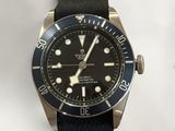 the watch is black and silver with a black dial