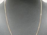 a gold chain necklace on a mannequin mannequin mannequin mannequin mannequin mannequin mannequin mannequin manne