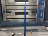an image of a commercial oven with a spatula in front of it