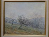 une peinture à l'huile d'un champ avec des arbres au loin