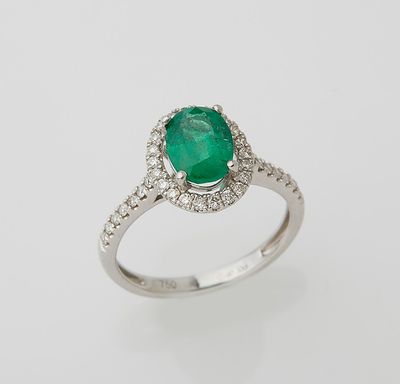 an emerald and diamond ring
