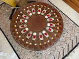 a picture of a decorative plate on the floor