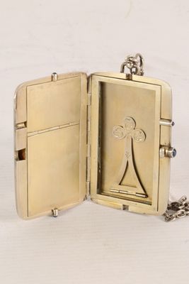 a gold locke with a picture of a woman on it