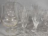 a lot of wine glasses that are sitting on a table