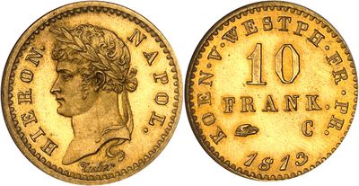 a gold coin with a woman ' s head and a crown on it