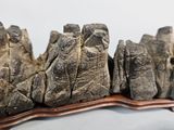 a large piece of rock that is sitting on a wooden stand