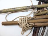 a bunch of bamboo sticks and a rope on a table