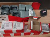 many boxes of electronic equipment on a table