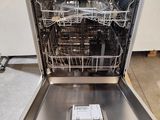 a dishwasher that is sitting in the middle of the floor