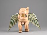 an image of a statue of a baby with wings on a gray background