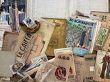 a pile of old books on a table next to a window