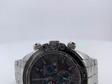 a close up of a watch on a white surface