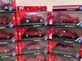 boxes of red toy cars are stacked on top of each other