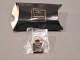 a small black bag with a black watch inside of it