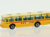 a yellow toy bus that is sitting on a table