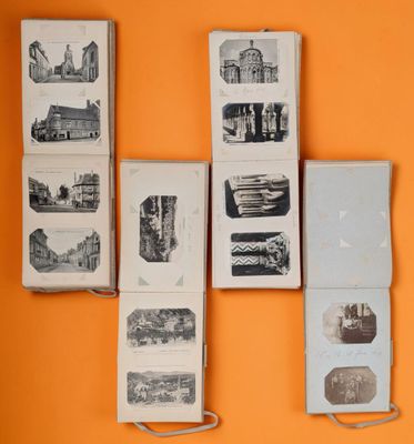 many books on the wall with pictures of buildings on them