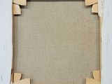 an overhead view of a picture frame on a red background
